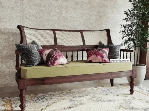 three-seater wooden sofa crafted from pure rosewood, a pure example of traditional classical design featuring handwoven cane work on the back, grassy design on the back and front, wooden hand rests, and smooth comfortable fabric.