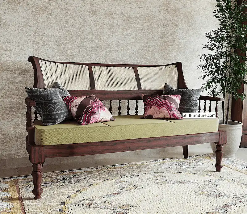 three-seater wooden sofa crafted from pure rosewood, a pure example of traditional classical design featuring handwoven cane work on the back, grassy design on the back and front, wooden hand rests, and smooth comfortable fabric.