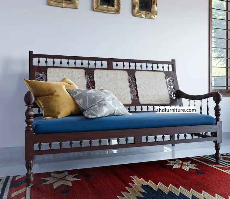 This image showcases a rosewood sofa set, a pure example of classic Indian furniture design, including a three-seater and two single-seater chairs featuring handwoven cane backrests, carved legs, grassy work on the sides, and ample sleek hand rests