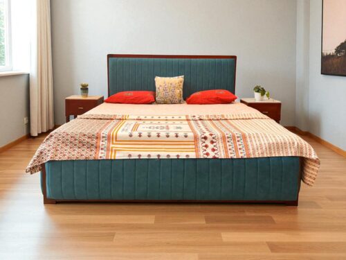 This Sarah Upholstered King Size Bed With Storage, Crafted from premium Kerala mahogany wood, this King size cot features a fully upholstered fabric design with fine vertical stitching for a sleek, modern look. The cot includes a spacious hydraulic storage system, offering easy access and ample room for organizing essentials. Its fully covered structure adds a sense of softness and sophistication, making it a perfect blend of comfort, utility, and contemporary style—ideal for today’s refined bedrooms.