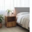 Natural wood bedside table with open shelf, lower drawer