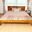 King size teak wood cot with slatted headboard, handcrafted from polished Kerala teak in a minimalist design