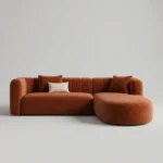 Rust velvet curved L-shaped sofa with channeled back, front view